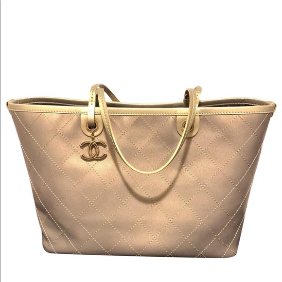 CHANEL Handbags - CHANEL tote Large Gold tote w dustbag, auth. card